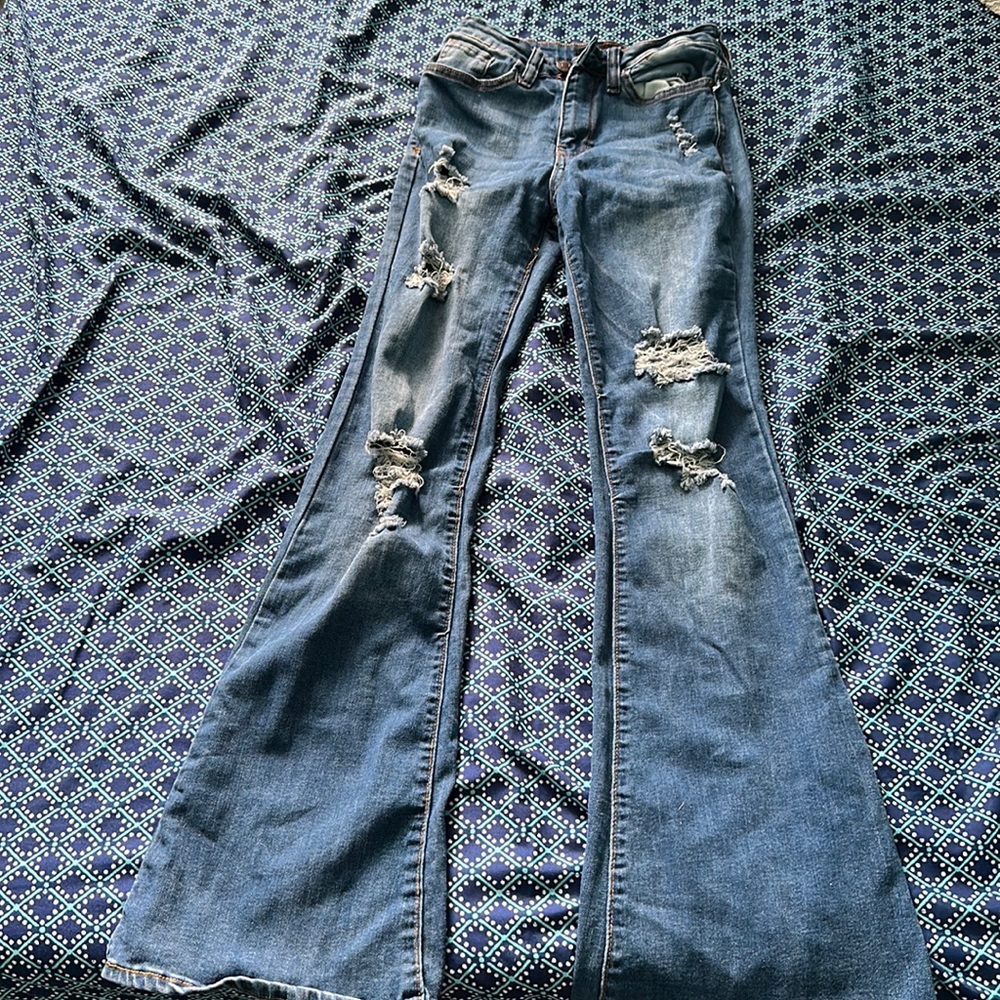Flared, ripped, high-rise denim jeans